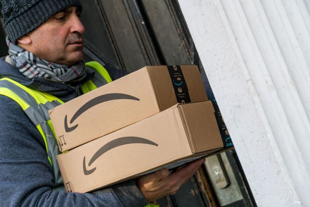 Image of an Amazon worker delivering parcels